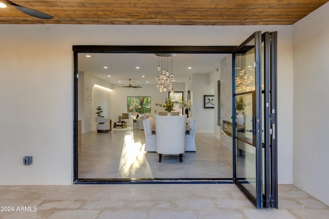 interior space with ceiling fan