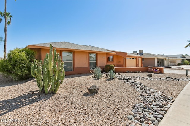 single story home featuring a garage