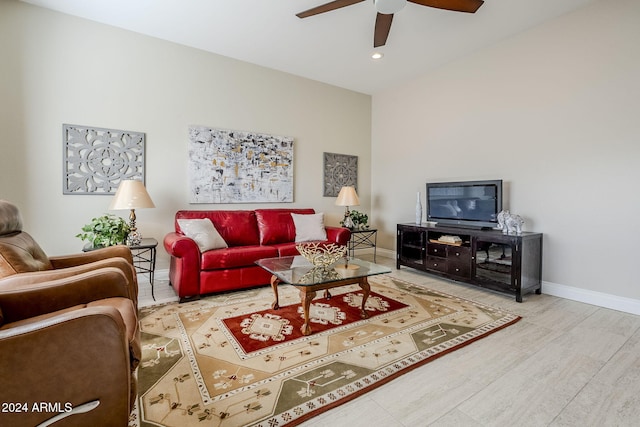 living room with hardwood / wood-style floors and ceiling fan