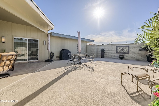 view of patio featuring a grill