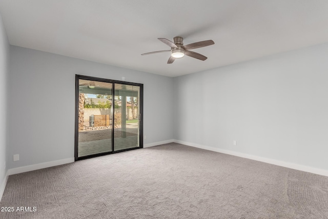 spare room with carpet and ceiling fan