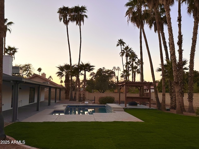 pool at dusk with a patio, central AC, a lawn, and a pergola