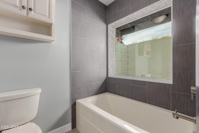 bathroom featuring toilet and shower / bath combination