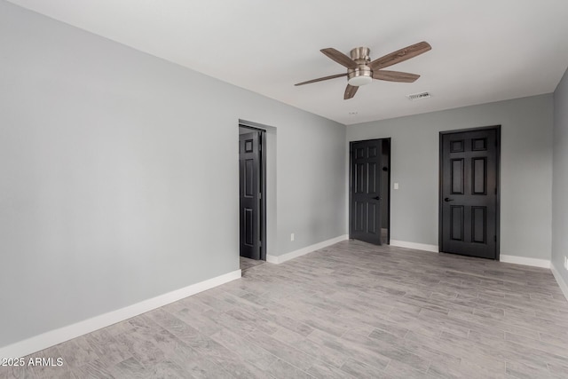 unfurnished room featuring ceiling fan and light wood-type flooring