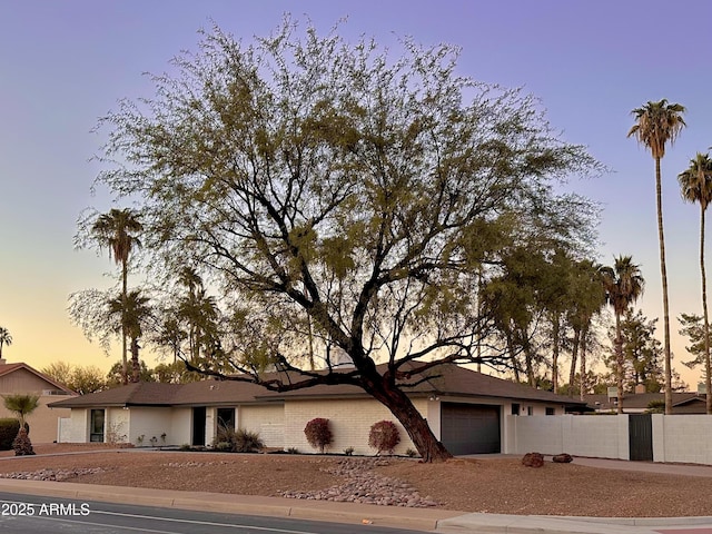 single story home featuring a garage