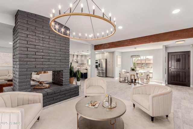 living room featuring beamed ceiling, light wood-type flooring, and a fireplace