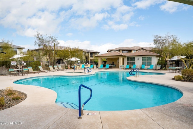 view of swimming pool with a patio