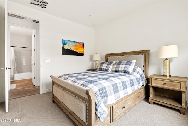 bedroom with light colored carpet