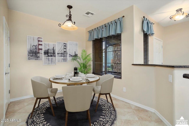 dining room with light tile patterned flooring