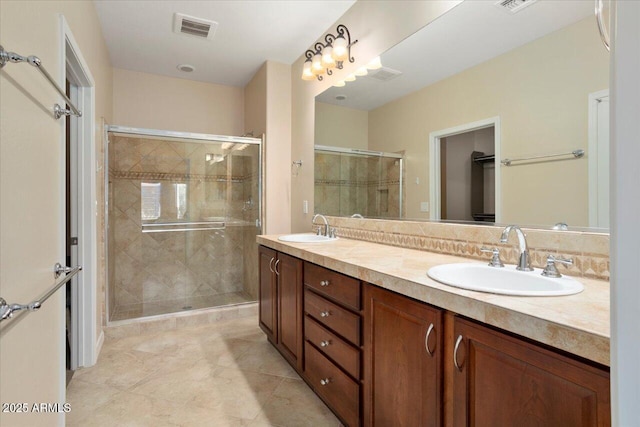 bathroom with vanity, tile patterned floors, and walk in shower