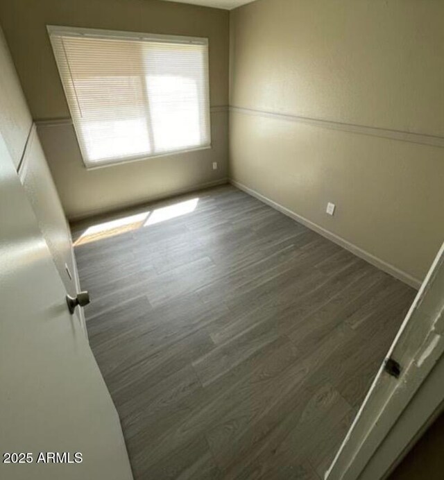 5420 W Lynwood St, Phoenix, AZ 85043 - unfurnished room with baseboards and wood finished floors