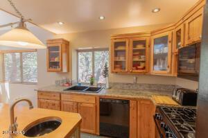 3458 N Meadow Dr, Pine, AZ 85544 - kitchen with black dishwasher, a sink, plenty of natural light, light countertops, and recessed lighting