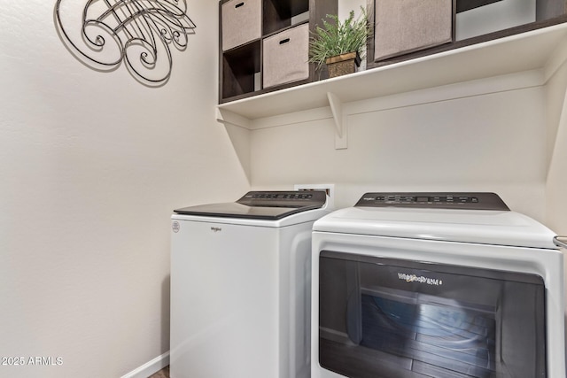 washroom featuring washer and dryer and laundry area