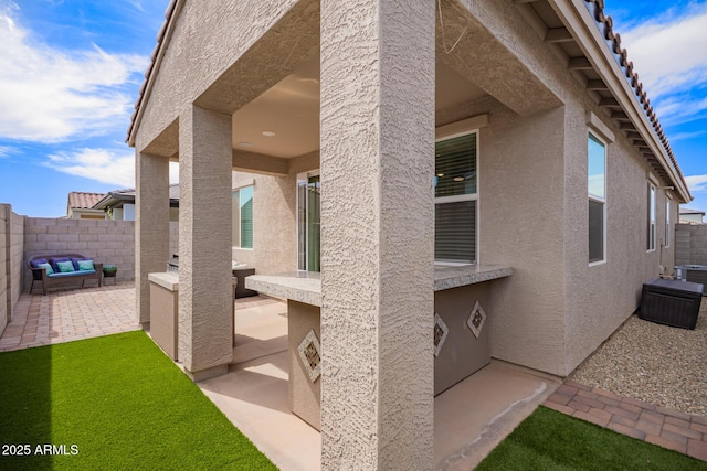 exterior space with cooling unit and a fenced backyard