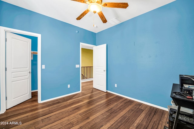 interior space with ceiling fan and dark wood-type flooring