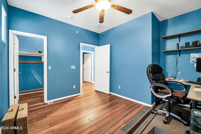 home office featuring ceiling fan and hardwood / wood-style flooring