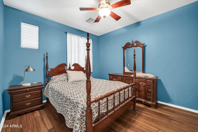 bedroom featuring dark hardwood / wood-style floors and ceiling fan