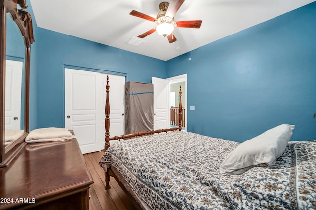 bedroom with hardwood / wood-style floors and ceiling fan