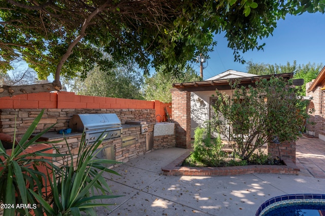 view of patio with exterior kitchen