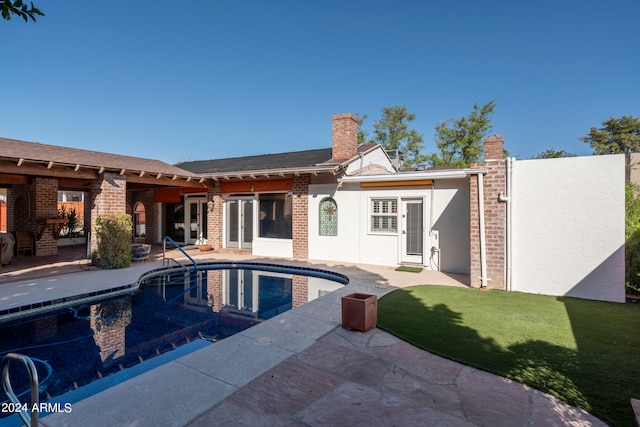 exterior space with a lawn and a patio area