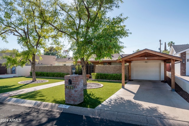 ranch-style house with a garage and a front yard