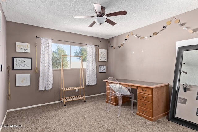 office space with ceiling fan, a textured ceiling, and carpet flooring