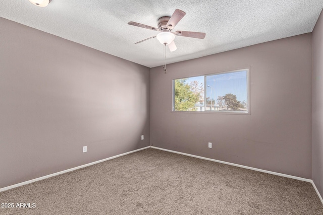 spare room with ceiling fan, carpet floors, and a textured ceiling