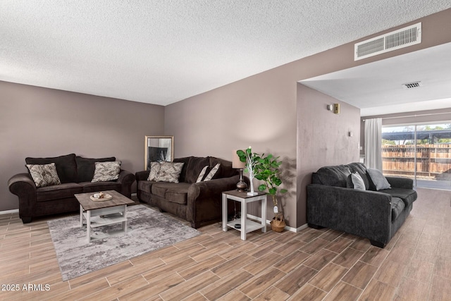 living room with a textured ceiling