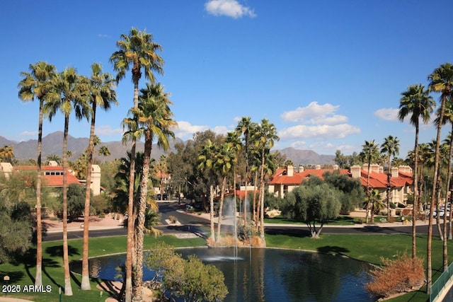 view of home's community with a water and mountain view