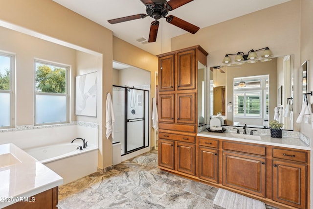 bathroom featuring separate shower and tub and vanity