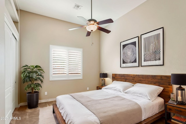 bedroom featuring carpet, ceiling fan, and a closet