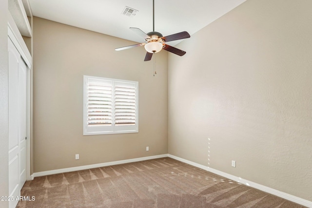 unfurnished bedroom featuring ceiling fan, a closet, and carpet