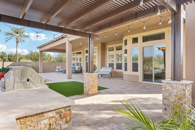 view of patio featuring a pergola