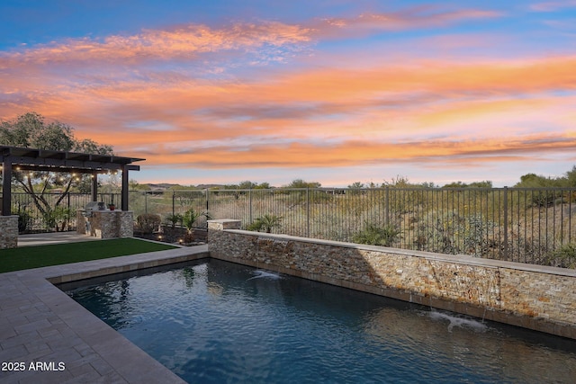 pool at dusk with a yard, pool water feature, and a pergola