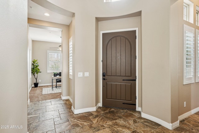 foyer with ceiling fan