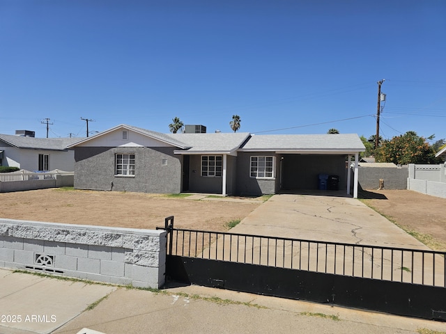 1630 E Catalina Dr, Phoenix, AZ 85016 - single story home with concrete driveway, an attached carport, a fenced front yard, stucco siding, and central AC