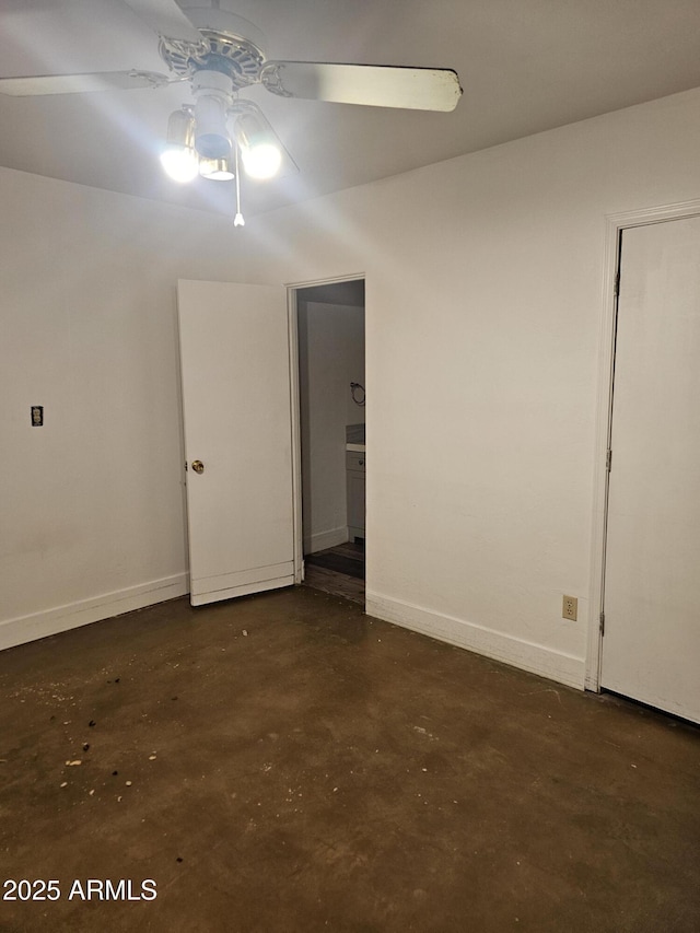 1630 E Catalina Dr, Phoenix, AZ 85016 - spare room featuring concrete floors, ceiling fan, and baseboards