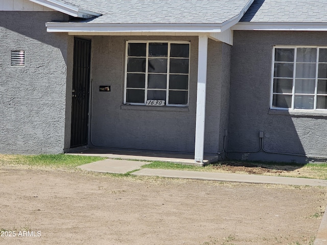 1630 E Catalina Dr, Phoenix, AZ 85016 - doorway to property featuring a shingled roof and stucco siding