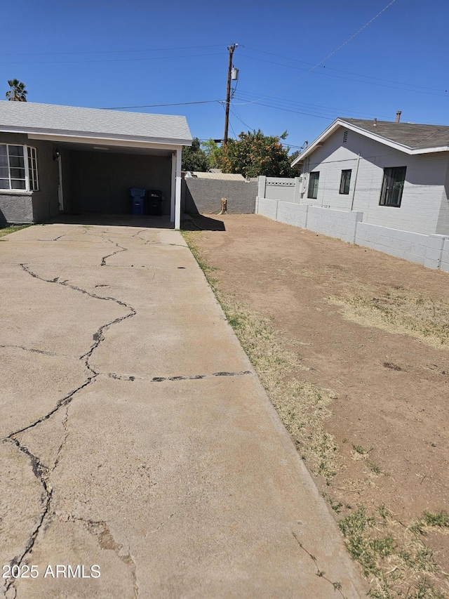 1630 E Catalina Dr, Phoenix, AZ 85016 - view of yard with driveway, fence, and an attached carport