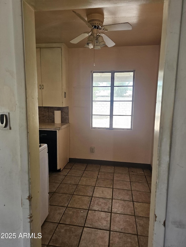 1630 E Catalina Dr, Phoenix, AZ 85016 - kitchen featuring ceiling fan, white cabinets, light tile patterned floors, light countertops, and baseboards