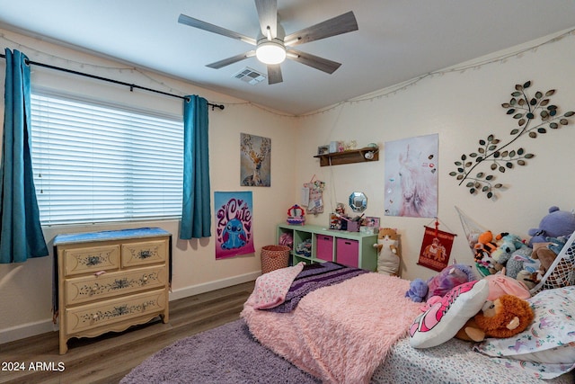 bedroom featuring ceiling fan and dark hardwood / wood-style floors