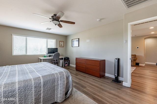 bedroom with wood-type flooring and ceiling fan