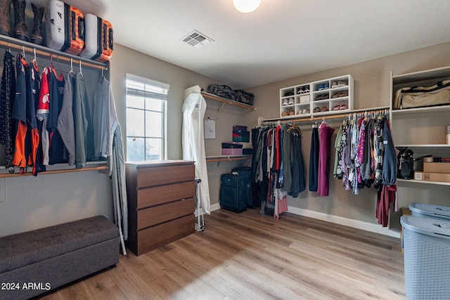 spacious closet featuring hardwood / wood-style flooring