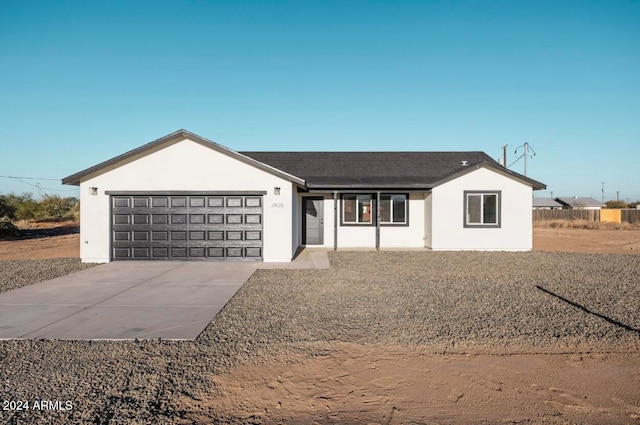 ranch-style home with a garage