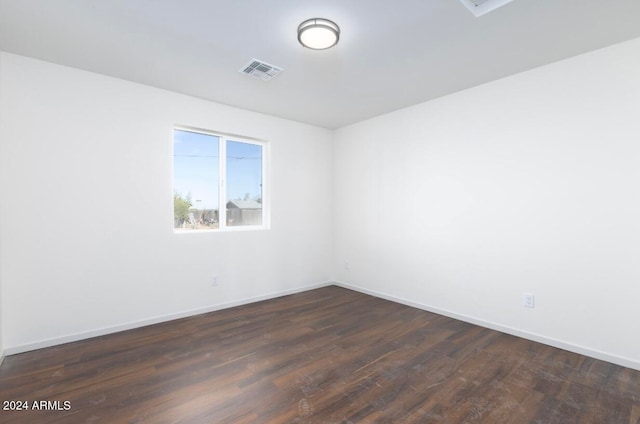 empty room featuring dark hardwood / wood-style flooring