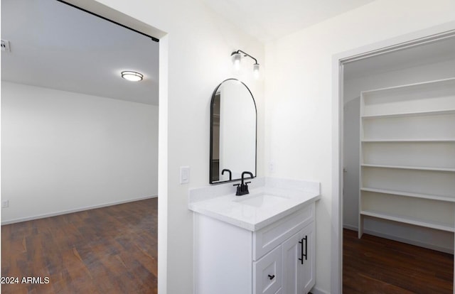 bathroom with vanity and hardwood / wood-style flooring