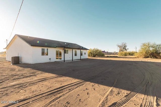 back of property with central air condition unit