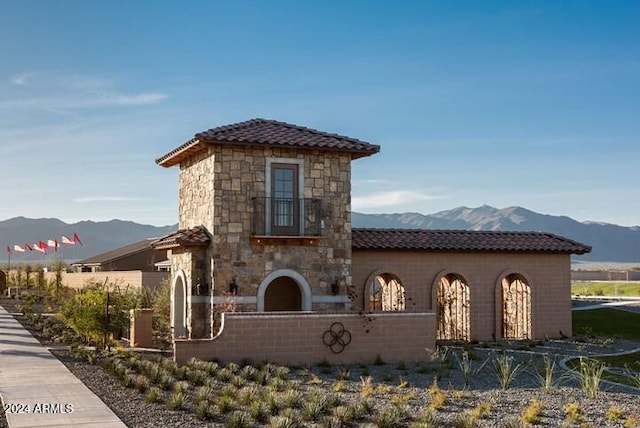 mediterranean / spanish-style home featuring a mountain view