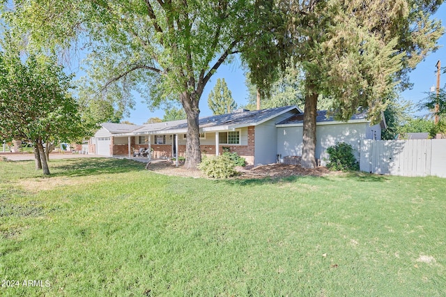 8049 N 16th Ave, Phoenix, AZ 85021 - view of front of property featuring brick siding and a garage