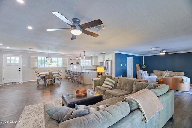8049 N 16th Ave, Phoenix, AZ 85021 - living room with a ceiling fan, dark wood-style floors, recessed lighting, ornamental molding, and baseboards